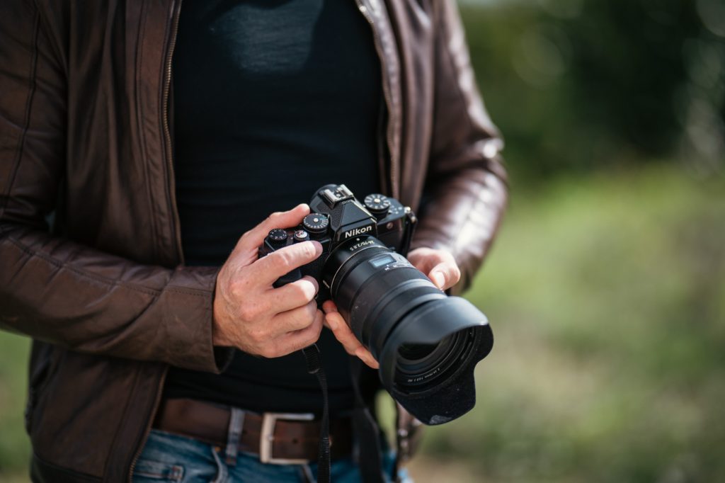 Nikon Zf with a larger fast lens and hood mounted